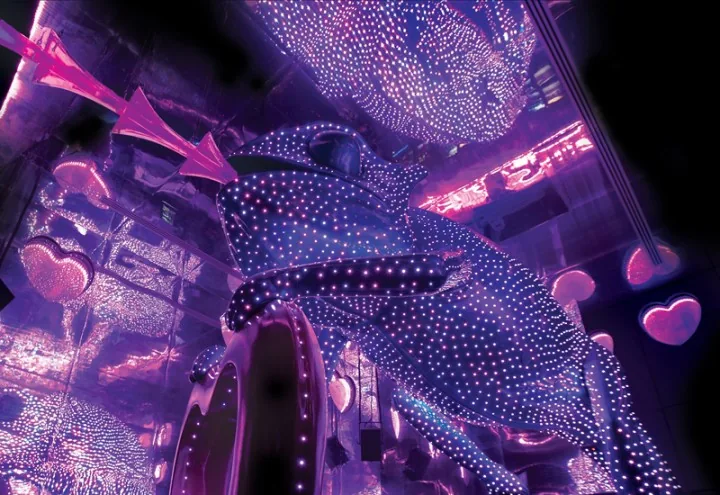 Close-up of the LED-studded chameleon sculpture at Chameleon Club Dubai