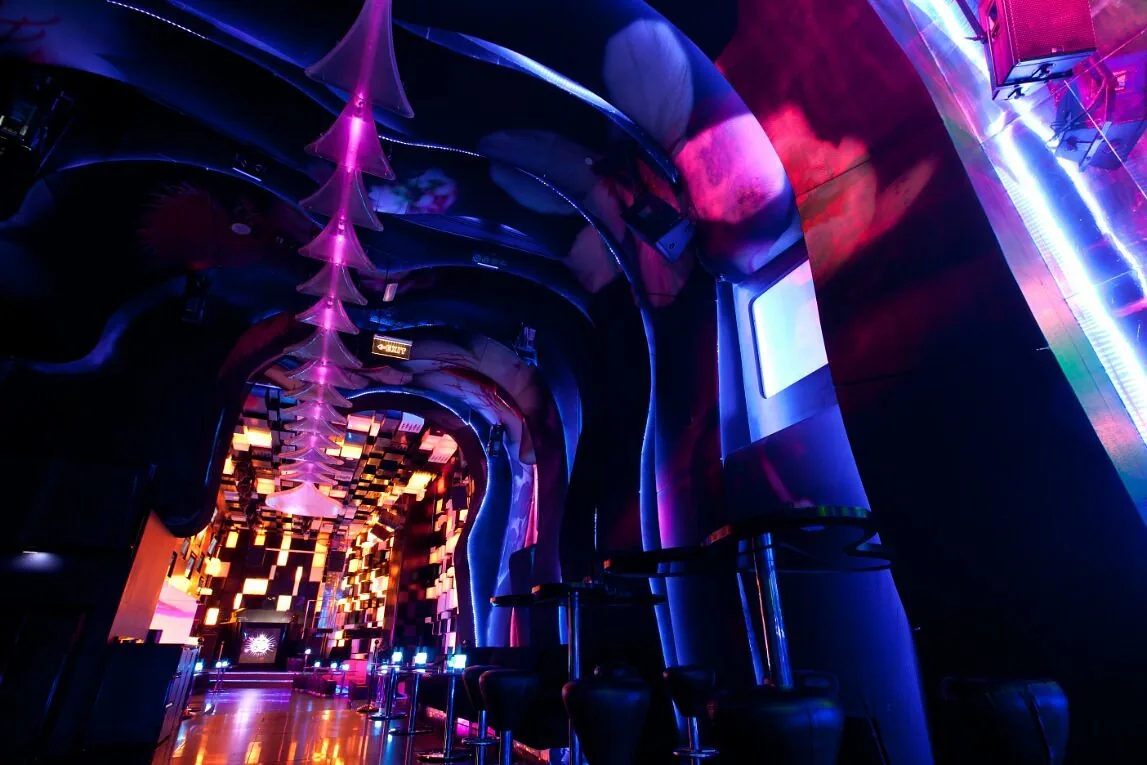 Glowing light tunnel corridor leading into Chameleon Club Dubai