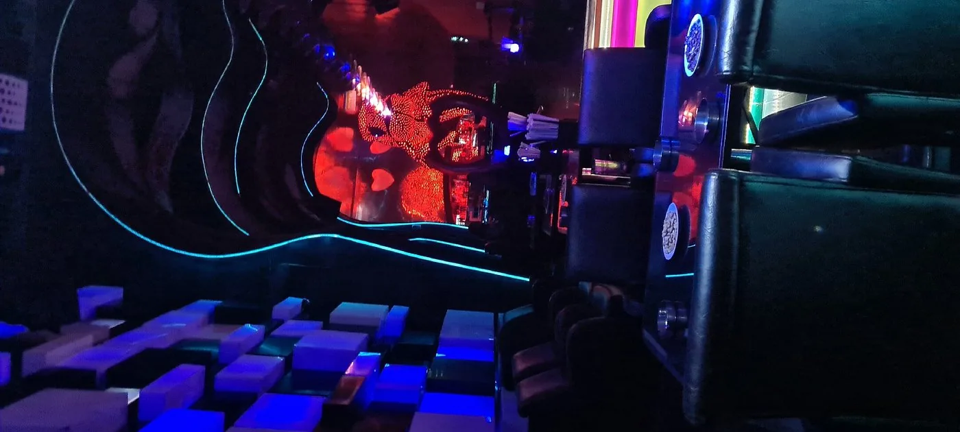 Wide view of the main stage DJ booth and sound system at Chameleon Club Dubai