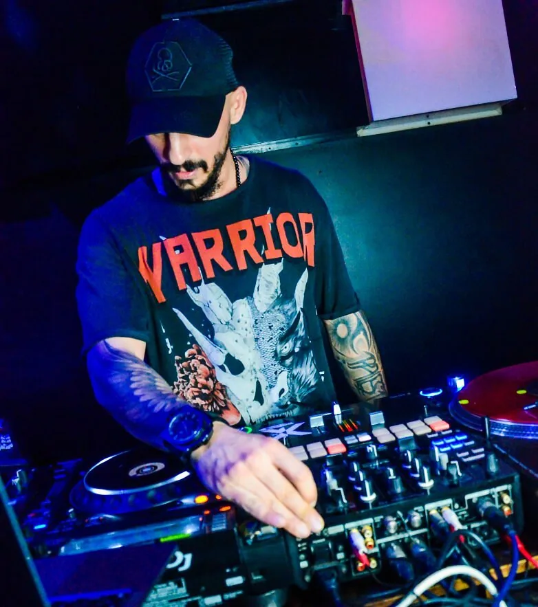 Resident DJ mixing on the decks at Chameleon Club Dubai