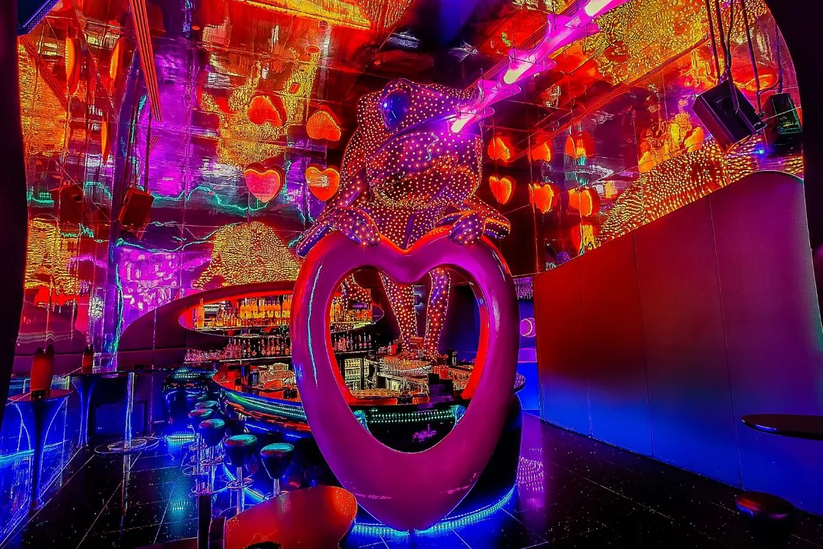 The Chameleon Heart: a glowing pink heart sculpture beside the circle bar at Chameleon Club Dubai
