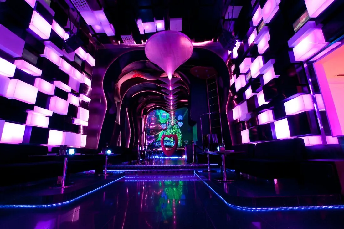 Chameleon Club Dubai main room glowing violet with LED cube walls and a mirrored floor