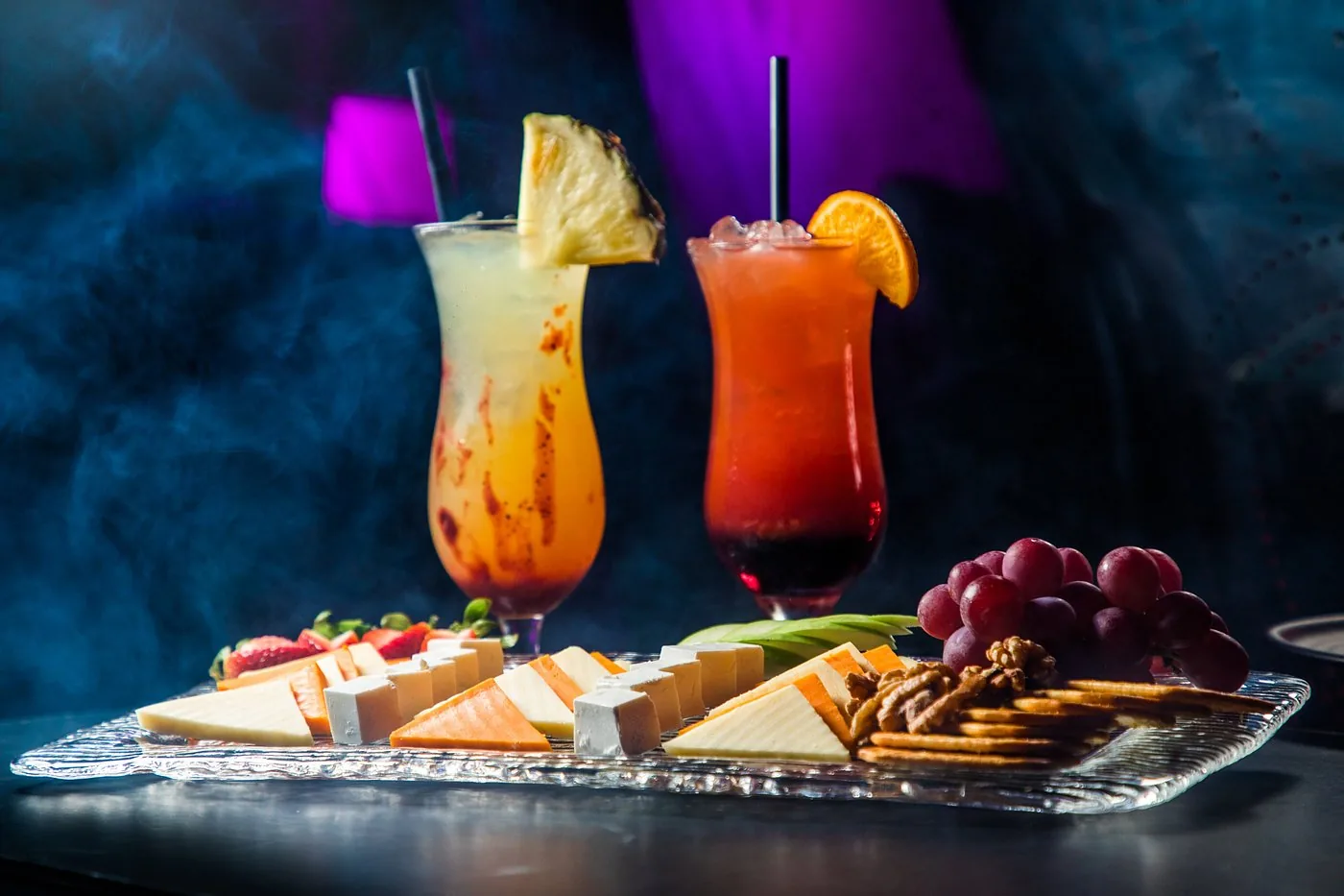 Cheese board served with tropical long drinks