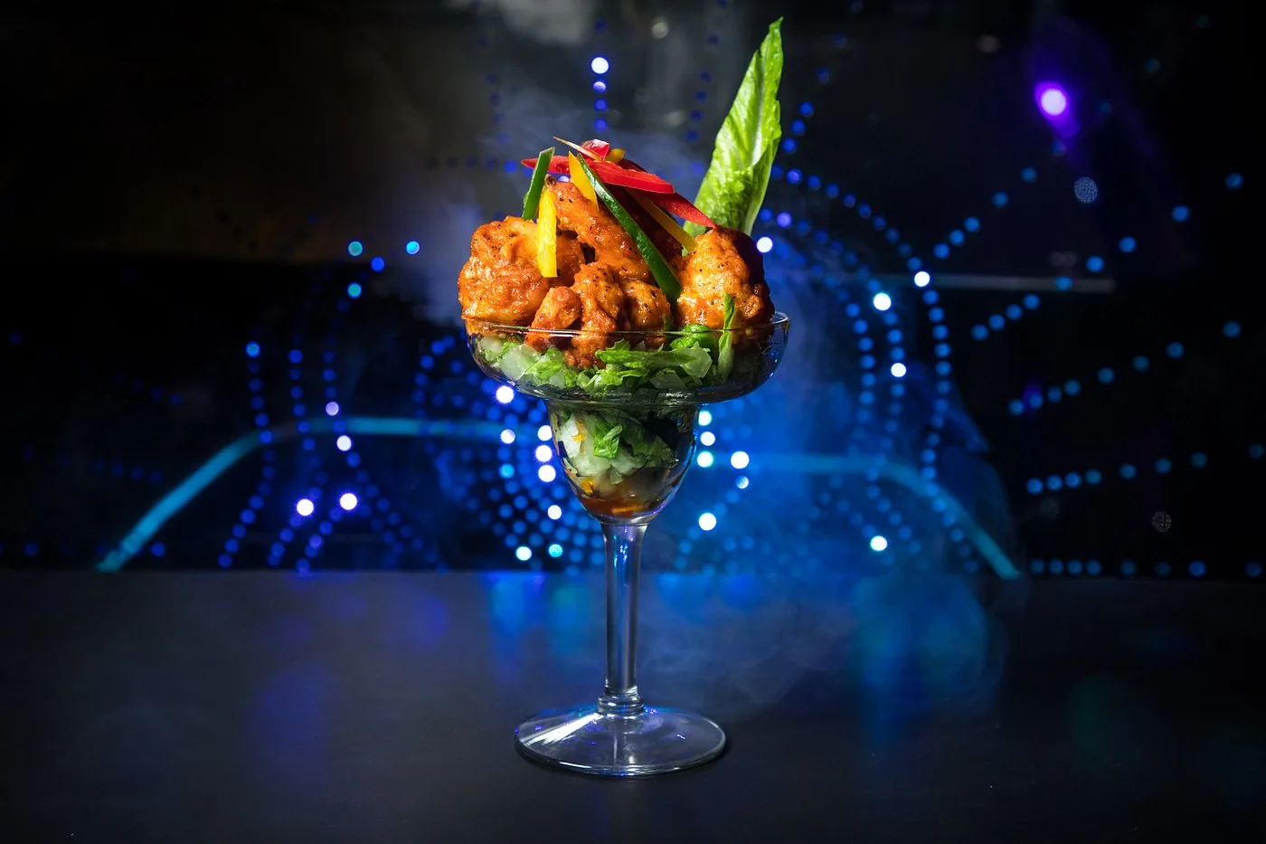 Crispy prawns served in a cocktail glass
