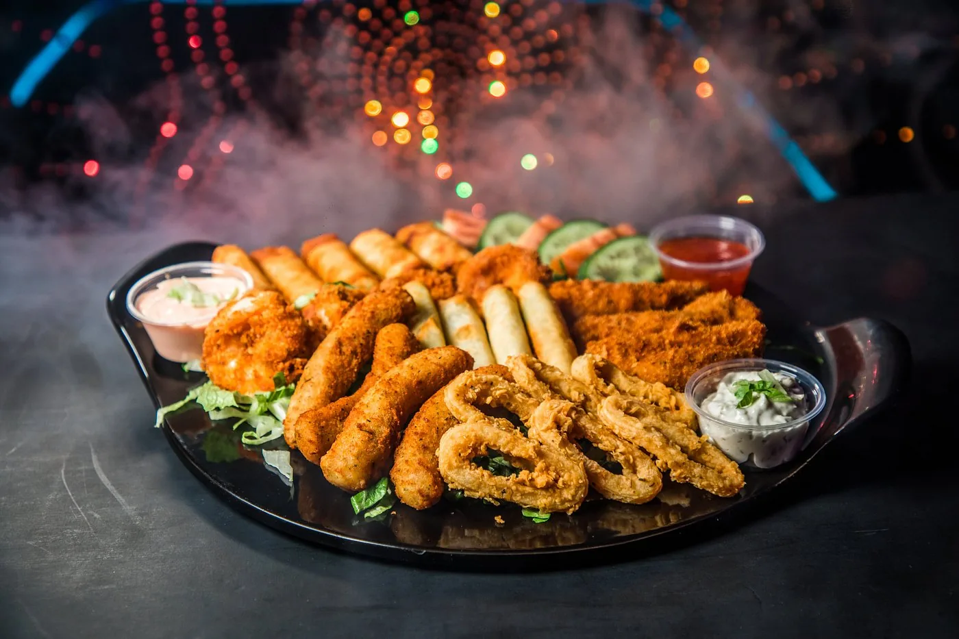 Crispy fried seafood platter with dipping sauces
